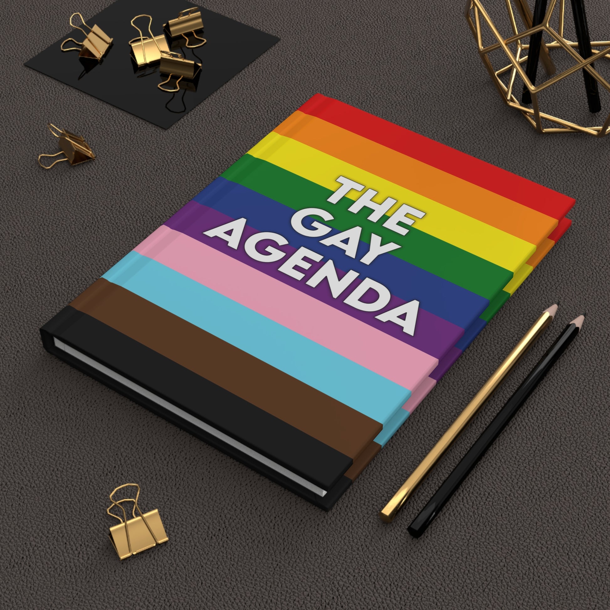 Front cover of The Gay Agenda LGBTQ+ hardcover journal with rainbow design